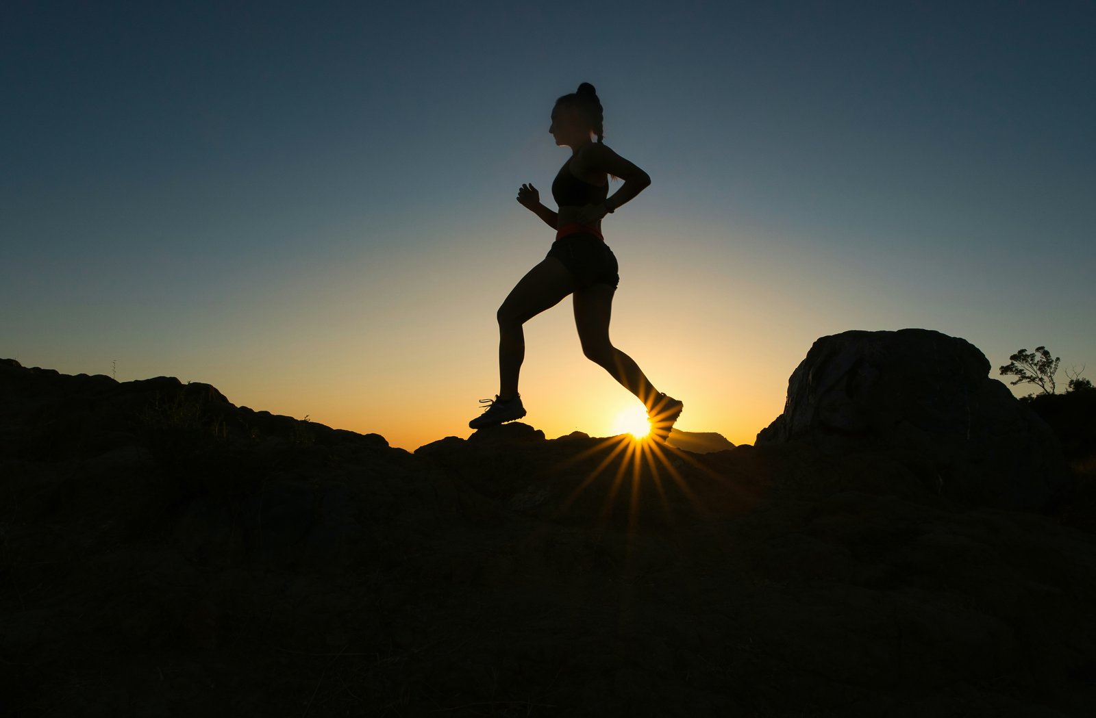 Silhouette of runner at sunset